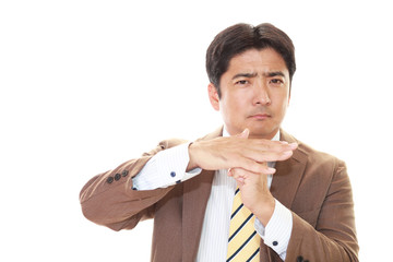 禁止の意思表示をするビジネスマン
