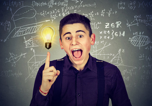 smart student with idea light bulb science formulas on blackboard