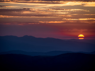 Sunrise over mountains with twilight sky