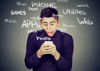 Shocked man using smart phone