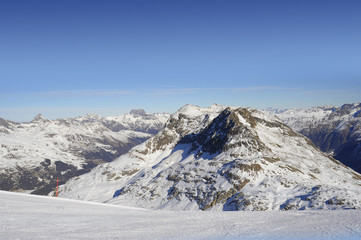  view of snow mountains and ski slope in Switzerland Europe on a cold sunny day