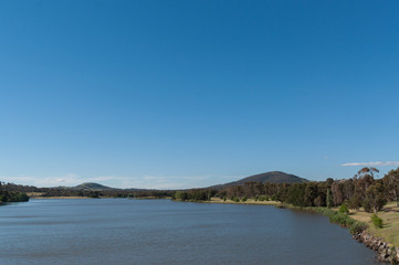 Fototapeta premium Canberra lake and hills view during afternoon.