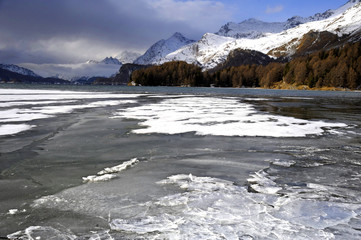 scenic view of winter snow mountains landscape and frozen lake in the swiss Alps in Engadin