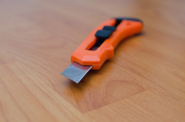 Utility knife on floor