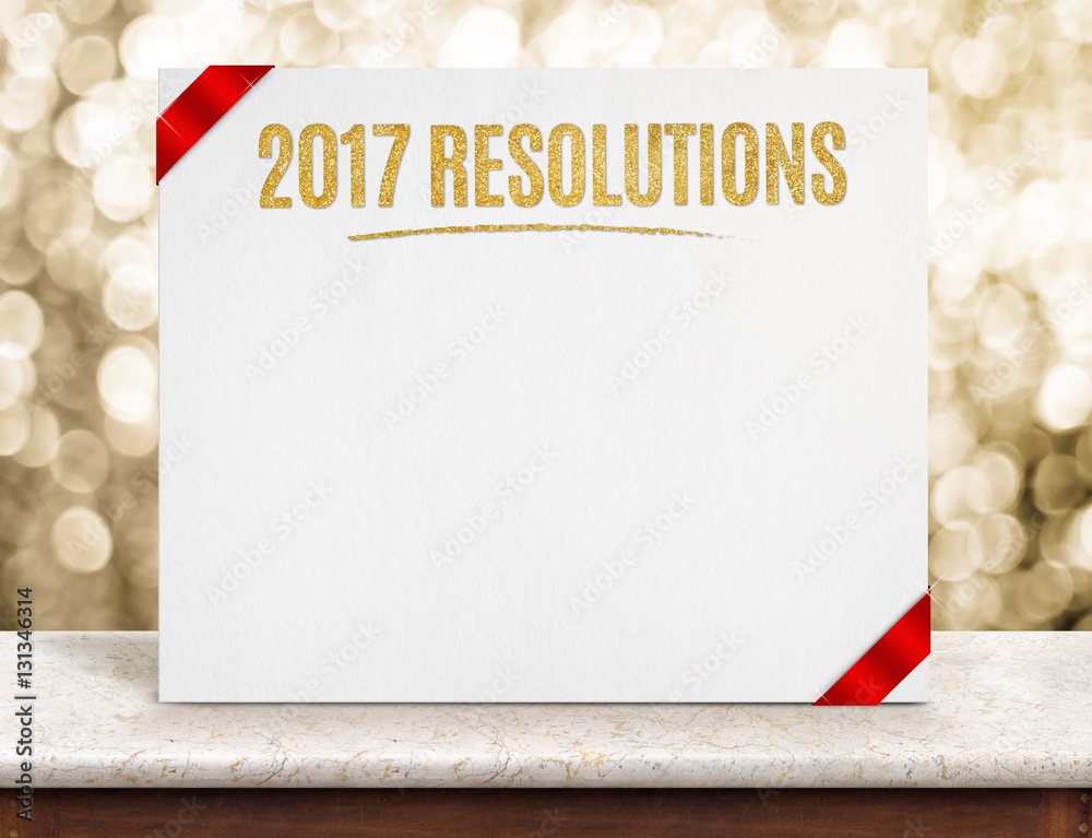 Poster 2017 resolutions on paper poster with red ribbon on marble table