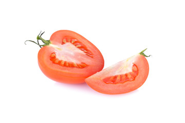 half and portion cut fresh tomato on white background