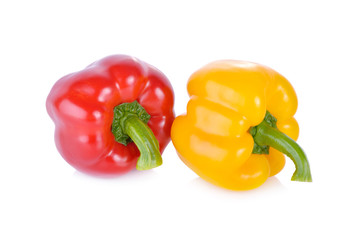 fresh red and yellow sweet pepper with stem on white background