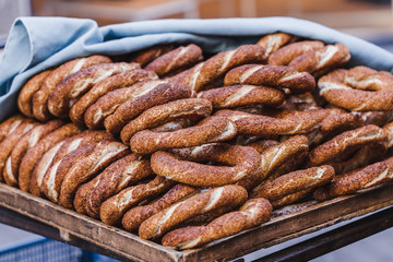Turkish bagel simit close up. Fresh baked pastries for sale on t