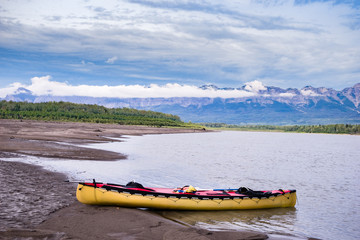 Fototapeta premium Canoeing Liard river downstream of Nahanni Butte village