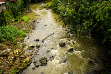 A dirty river flow photo taken in Bogor Indonesia