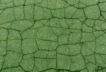 green toned damaged asphalt texture.