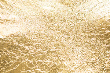 Gold wrinkled paper texture abstract background