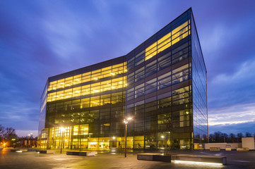 Office building with glass facade,Modern office building in the evening