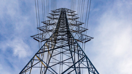 the high voltage post. High-voltage tower sky background