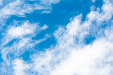 the white fluffy clouds in the blue sky