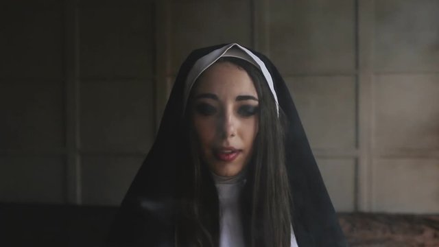 bad nun smoking a cigarette