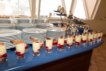 white and red tiramisu with gingerbread in boat cruise ship