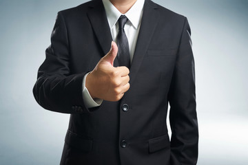 Successful businessman gives thumb up  style. Likes and positive feel. Gesture good and agree , finger agreement