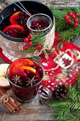 Old metal pan with tasty mulled wine on  rustic wooden table