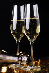 Conceptual Golden Brown Wine on Elegant Glass with Spiral Thin Wrapping Foils or Laces Decoration, on Abstract Brown Background.