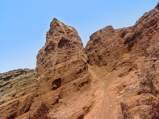 Fototapeta premium Beautiful wide panoramic view of red beach in Santorini