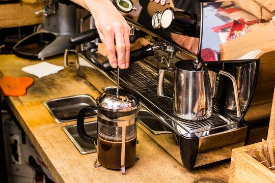 Barista Making Non Traditional Coffee In French Press