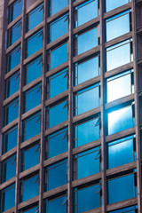 Fototapeta premium Detail of modern multi-storey hotel with glass facade