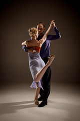 Fototapeta na wymiar The man and the woman dancing argentinian tango