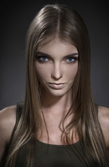 Fototapeta premium Portrait of a girl with beautiful eyes and a sad look