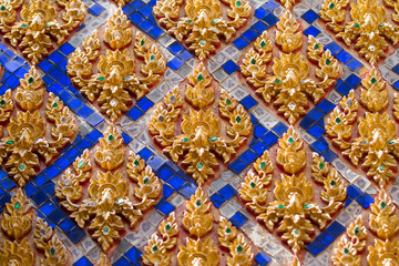Traditional Thai style stucco on the wall of church in temple, T