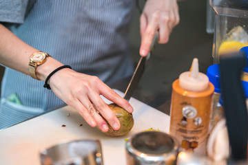 female hand cut passion fruit