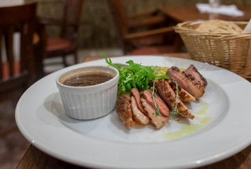 Duck Breast served with plum jam and salad
