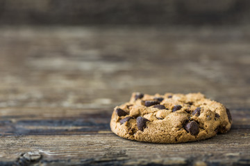 Chocolate Chip Cookie on Rustic Wooden Table Background