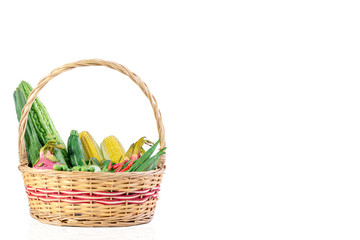 Fototapeta na wymiar Vegetables and fruits in wicker basket isolated on white background.