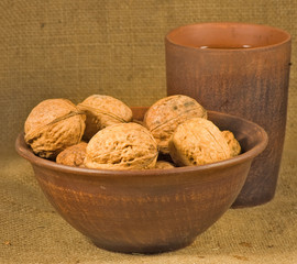Big walnuts in a bowl close-up.