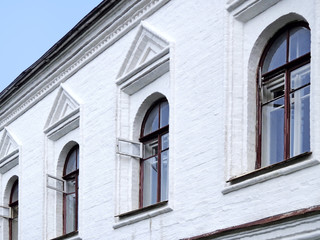 Windows on the white wall of the house