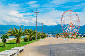 Seafront Promenade on Black Sea coast with ferris wheel view in Batumi, Adjara, Georgia