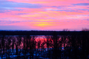 Beautiful sunset over the frozen river