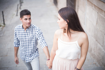 Woman walking on romantic honeymoon and holidays holding hand.
