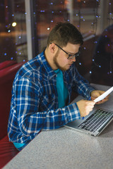 man working in cafe