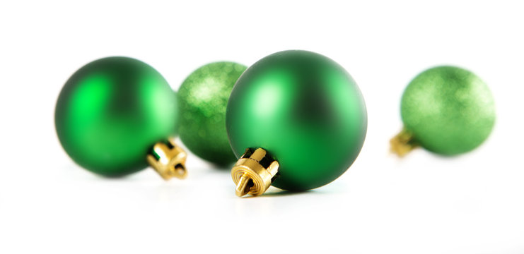 Green christmas decorations on a white background