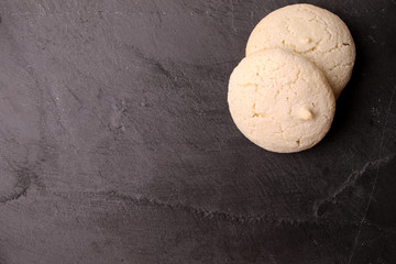 homemade macaron on stone slate board.