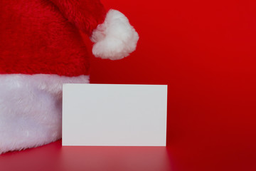 Santa Claus hat with a blank card good for test on red