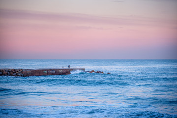 Romantic place, lovers meet on the sea at sunset.