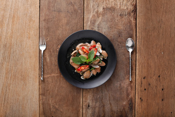 Spicy fried Clams with herb,Ready to eat. On The Table