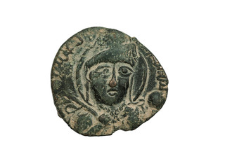 Ancient copper islamic coin with portrait isolated on white