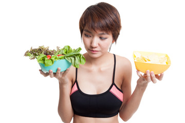 Beautiful Asian healthy girl salad and potato chips.