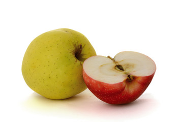 One yellow apple and half reds apple