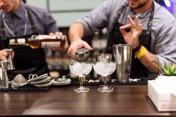 Barman show. Bartender is making cocktail at night club.