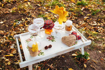 Fototapeta premium tray with a bottle of wine, jam. Autumn decor